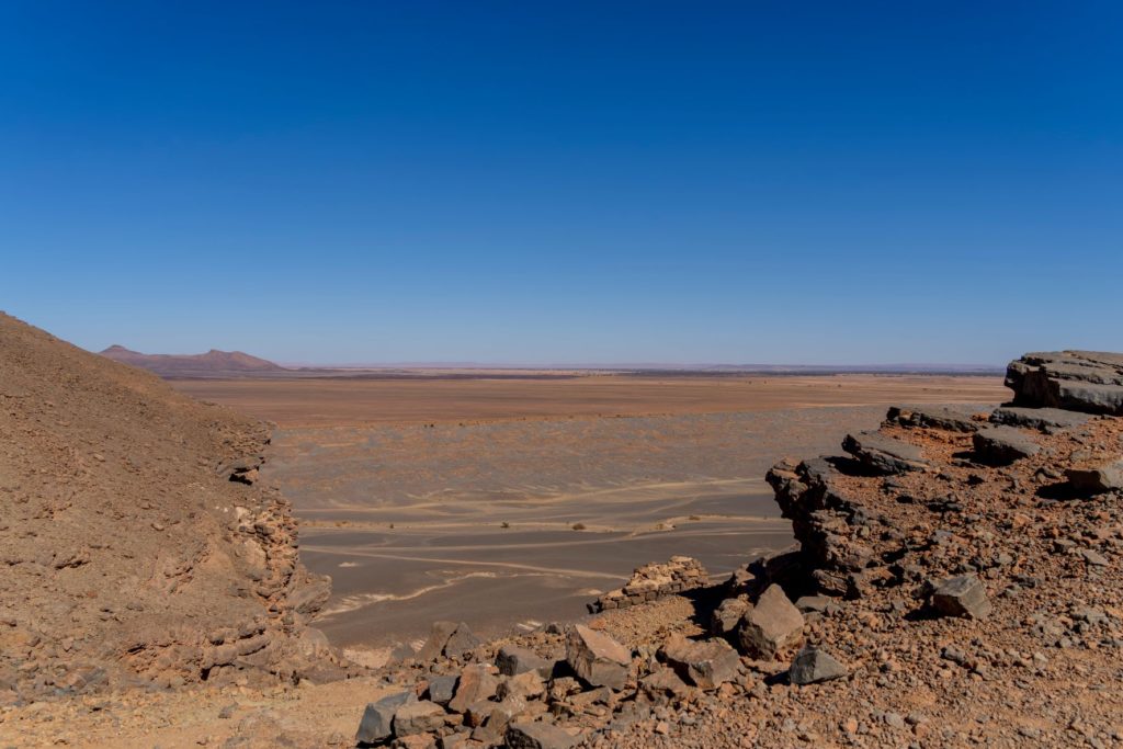 Featured in Jaya Travel & Tours blog "The Mummy Film Locations", this image shows a wide view of the sandy desert of gara medouar in morocco.
