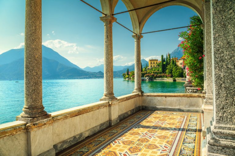 The beautiful landscape of Lake Como in Italy, photographed from the balcony of an opulent mansion in the coastal town of Varenna, which is featured in Jaya Travel & Tours customized tour enchanting Italy!
