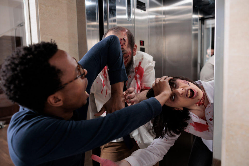 Frightened scared man running from monsters in Jaya Travel & Tours blog "Halloween Destinations around the world".