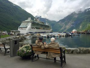 - Jaya Travel & Tours Top 5 Travel Destinations for Retirees blog- Picture of two elderly people looking at a cruise ship from the dock from Jaya Travel & Tours blog
