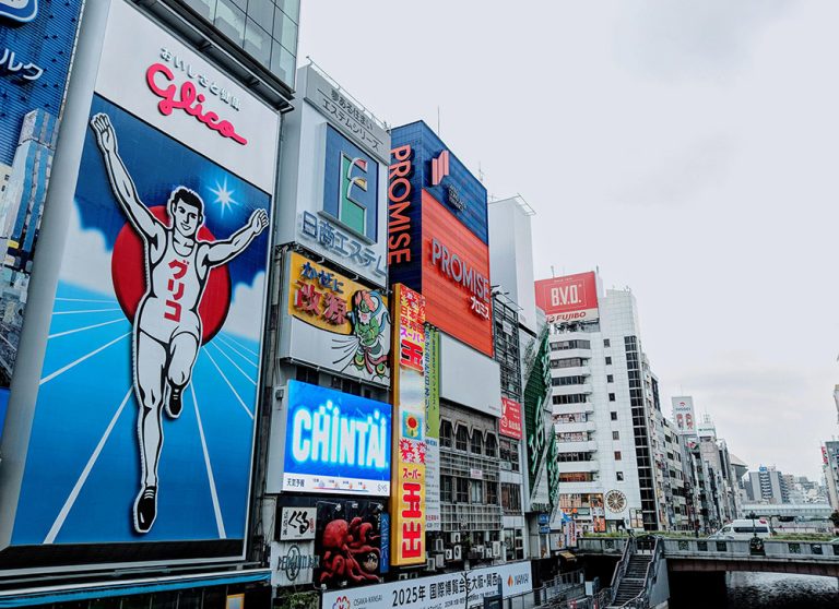 Featured in "Japan Tour: Rich History & Culture" by Jaya Travel & Tours, this image shows the iconic Glico Man sign in the Dotonbori District in Osaka.
